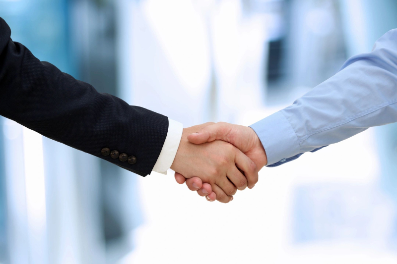 Handshaking businessmen